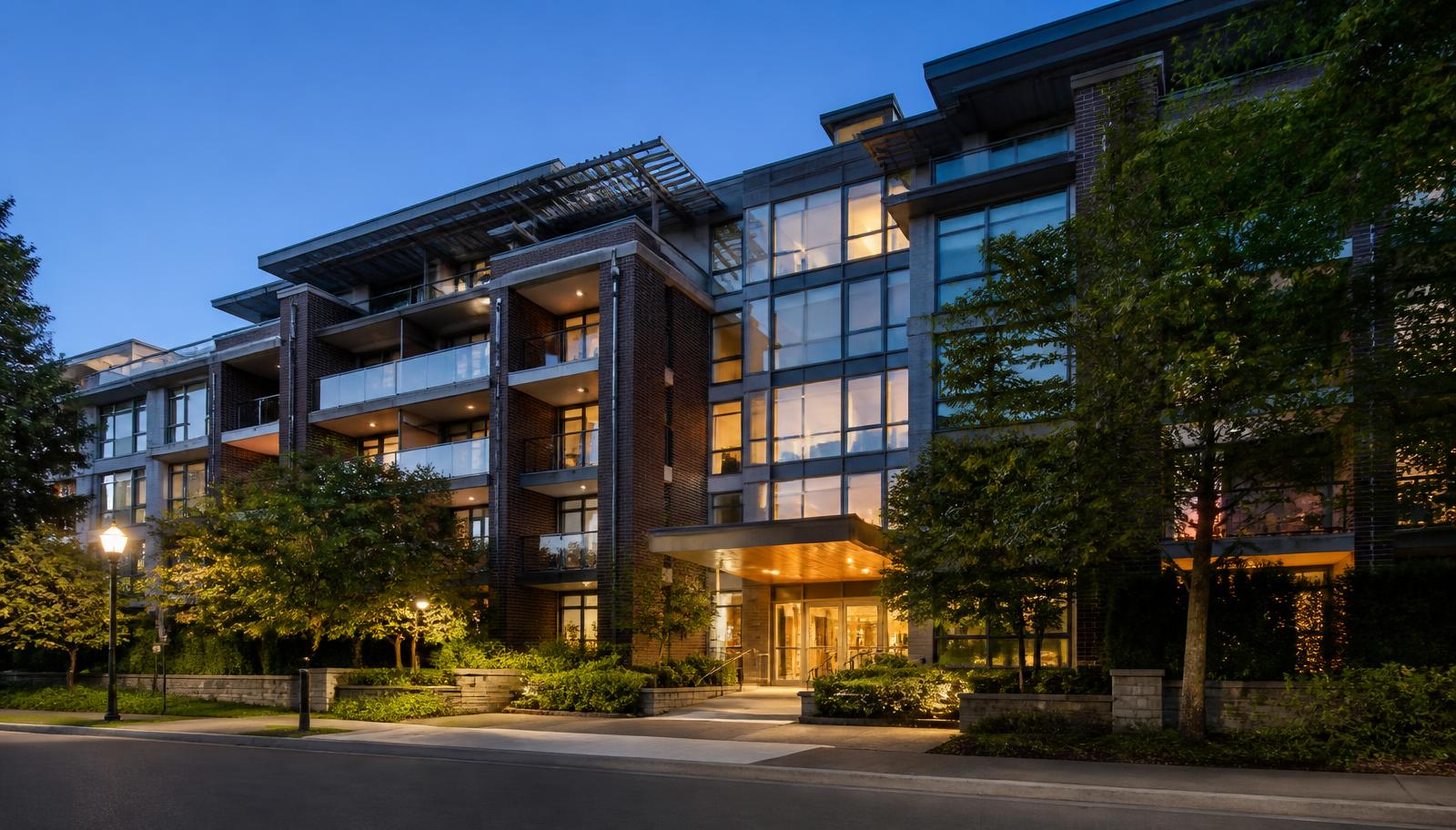 Modern mid-rise condominium building with balconies at blue hour