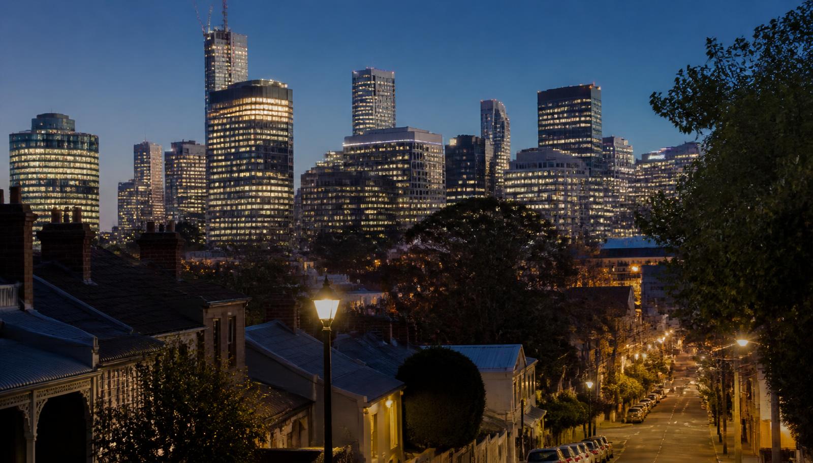 Uptown Charlotte skyline seen at dusk from a historic residential street